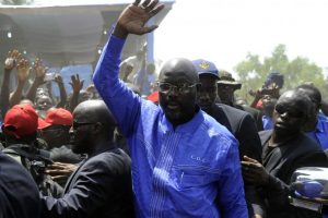 Former Liberian footballer George Weah, pictured at his party's headquarters in Monrovia, April 28, wants to extend his dominance from the sporting sphere to the political by running for the country's presidency in 2017. ZOOM DOSSO/AFP/GETTY IMAGES