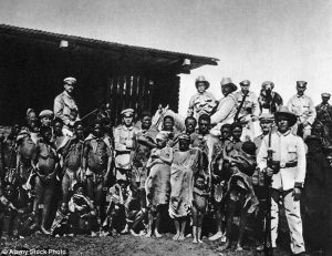 German troops pose for a photo with tribe members during the genocide from 1904 to 1908