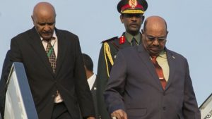 Sudan President Omar al-Bashir, right, arrives in Kigali, Rwanda, July 16, 2016, to attend an African Union summit. He defied an international arrest warrant after public assurances from Rwandan leaders that he would not be arrested. He is wanted by the ICC for alleged atrocities in his country's Darfur region.