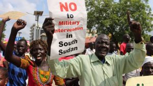 Hundreds of South Sudanese protest in Juba, South Sudan against Foreign military intervention Wednesday July 20, 2016. Hundreds of people from civil society and political parties protested in Juba. This week African leaders have backed plans to deploy regional troops to South Sudan after recent fighting between rival forces left hundreds of people dead . (AP Photo/Samir Bol)