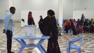 FILE - A woman casts her vote during Somalia's parliament election, at a polling station in Mogadishu, Somalia, Dec. 6, 2016.