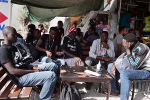 Migrants from Mali sit in a canteen outside the Moria camp on the Greek island of Lesbos, September 20. The EU has signed a deal with Mali to expedite the return of failed asylum seekers from the North African country. LOUISA GOULIAMAKI/AFP/GETTY
