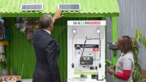 FILE - President Barack Obama looks at a solar power exhibit during a tour of the Power Africa Innovation Fair, Saturday, July 25, 2015, in Nairobi, Kenya. In Nigeria, Lumos Global is among the firms rolling out solar power technology.