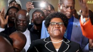 FILE - Zimbabwe's former vice president Joice Mujuru smiles while addressing supporters in Harare, March 1, 2016.