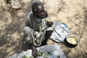 In this photo taken Sunday, March 19, 2017, Rosa Lyo eats fruit at a camp for those who were previously displaced by fighting, near a church in Rajaf, South Sudan. As the world marks World Water Day on Wednesday, March 22, 2017 more than 5 million people in South Sudan do not have access to safe, clean water, compounding the problems of famine and civil war, according to UNICEF. (Matthieu Alexandre/Caritas Internationalis via AP)