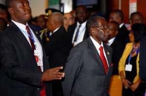 Zimbabwe's President Robert Mugabe arrives at the African Union headquarters during the opening ceremony of the 29th Ordinary Session of the Assembly of the Heads of State and the Governments, in Addis Ababa, Ethiopia July 3, 2017. REUTERS/Tiksa Negeri