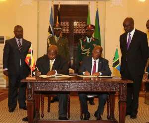 Museveni and Magufuli signing the oil pipeline agreement in Tanzania recently
