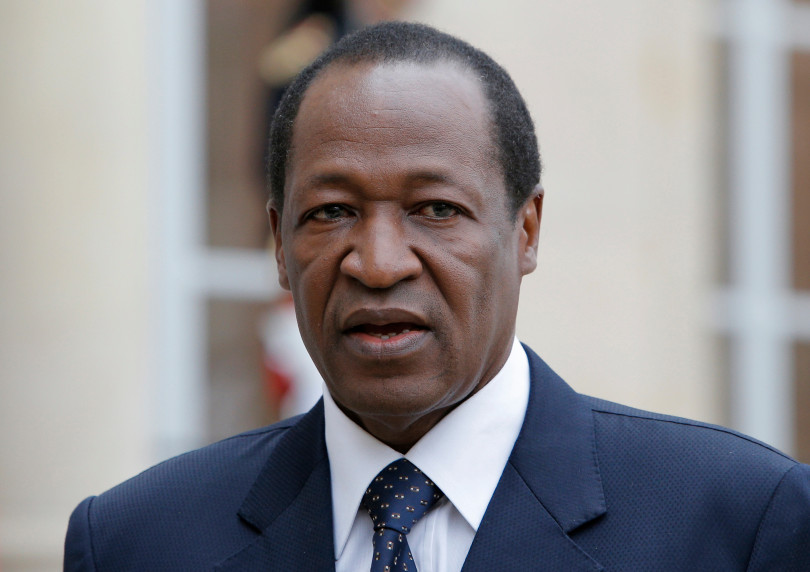 FILE - In this Sept. 18, 2012 file photo, the then Burkina Faso's president Blaise Compaore speaks to the media after a meeting with France's President Francois Hollande in Paris. Compaore came to power after a bloody 1987 coup that killed the West African nation's revolutionary leader Thomas Sankara. After ruling for more than 27 years, Compaore tried to amend the constitution to seek another term in office. Faced with a popular uprising, he was forced to step down in 2014. (AP Photo/Francois Mori, File)