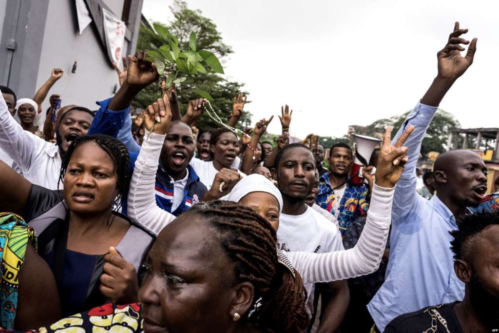 FILE - Catholics take part in a demonstration calling for the president of the Democratic Republic of the Congo to step down in Kinshasa, Dec. 31, 2017.