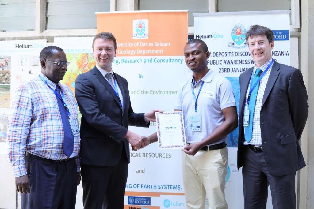 Helium One’s Chief Executive Officer, Thomas Abraham-James hands a sponsorship certificate for a funded MSc programme at Oxford University to Karim Mtili, a graduate of BSc with Geology from University of Dar es Salaam. The sponsorship is geared towards imparting world-class technical skills and scientific expertise to Tanzanians. Witnessing this is Prof Christopher Ballentine from Oxford University and Prof Hudson Kotago from University of Dar es Salaam