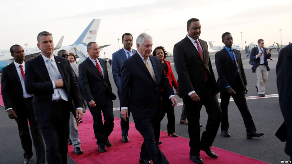 Ethiopia's Minister of Foreign Affairs Workneh Gebeyehu (center R) walks the red carpet with U.S. Secretary of State Rex Tillerson as he arrives to begin a six-day trip in Africa, landing at Addis Ababa International Airport in Addis Ababa, March 7, 2018.