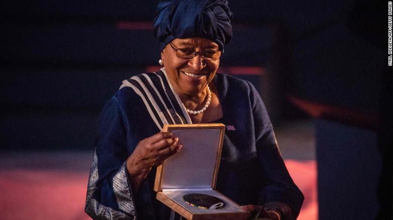 Former President of Liberia Ellen Johnson Sirleaf reacts with the medal after receiving the Ibrahim Prize, the world's biggest individual prize for Achievement in African Leadership, during 2018 Ibrahim Governance Weekend at Kigali Convention Centre in Kigali, Rwanda late April 27, 2018. She is the first woman who receives the award as 5th laureate since 2007. The prize only goes to a democratically-elected African leader who demonstrated exceptional leadership, served their mandated term and left office within the last three years. The award comes with $5 million (4.7 million euros) paid over 10 years and $200,000 annually for life from then on. / AFP PHOTO / Cyril NDEGEYACYRIL NDEGEYA/AFP/Getty Images