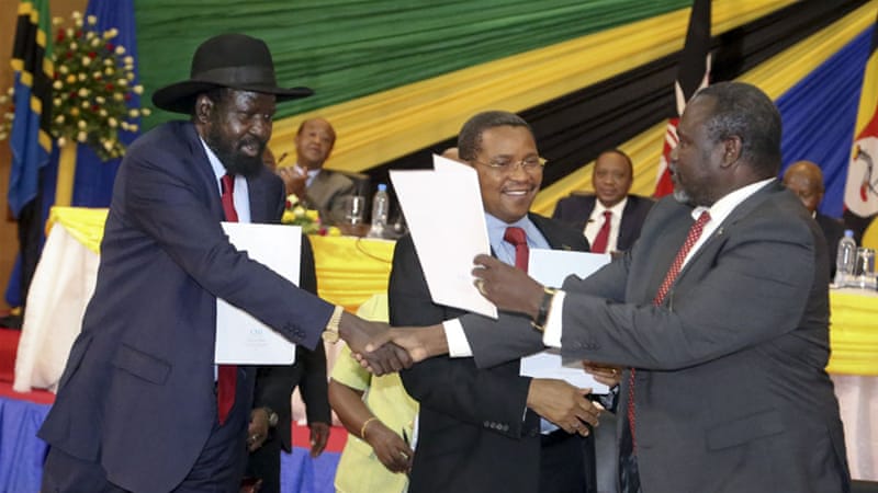 South Sudan's President Salva Kiir and rebel leader Riek Machar come to an agreement to end the conflict and form a government of national unity in August 2015 [The Associated Press] 