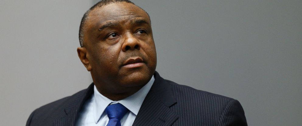 FILE - In this June 21, 2016 file photo, former Congolese Vice President Jean-Pierre Bemba enters the courtroom of the International Criminal Court in The Hague, Netherlands. International Criminal Court appeals judges overturned Friday, June 8, 2018 the convictions of former Congolese Vice President Jean-Pierre Bemba for atrocities committed by his forces in Central African Republic. The reversal delivered a serious blow to ICC prosecutors by scrapping all the convictions in the court’s first trial to focus largely on sexual violence and on command responsibility - the legal principle that a commanding officer can be held responsible for crimes committed by his or her troops or for failing to prevent or punish the crimes. (Michael Kooren, Pool via AP, File)
