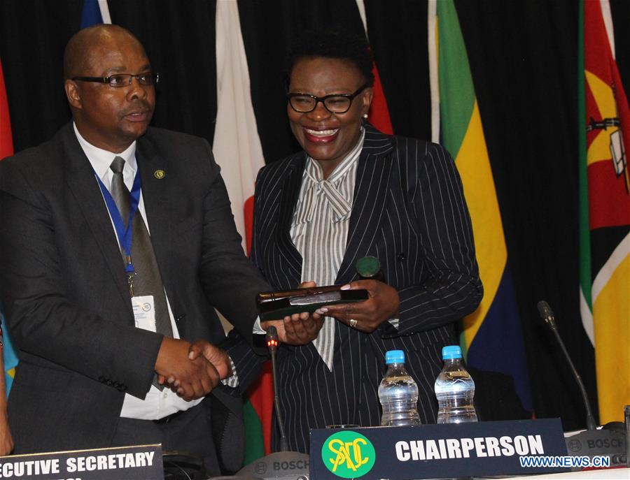 Selma Ashipala-Musavyi (R), Namibia's Permanent Secretary of the Ministry of International relations and Cooperation, takes over the chair of the Standing Committee of the Senior Officials of the Southern African Development Community (SADC) at the 38th Ordinary SADC Summit in Windhoek, capital of Namibia, on Aug. 9, 2018. The 38th Ordinary SADC Summit takes place under the theme "Promoting Infrastructure Development and Youth Empowerment for Sustainable Development" and will end on Aug. 18. (Xinhua/Nampa) 