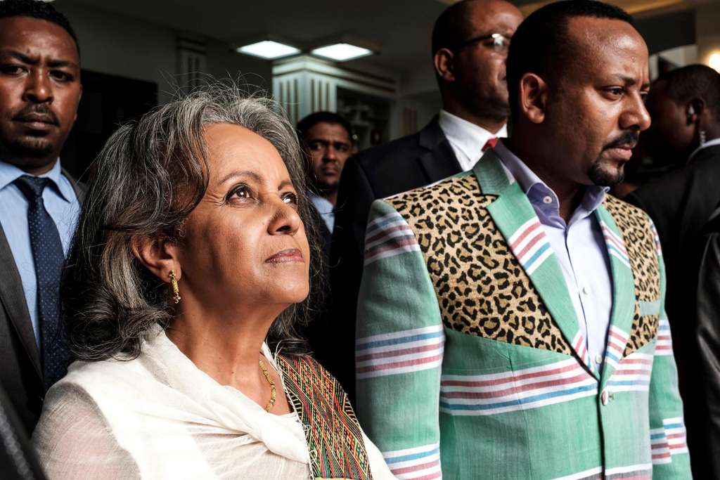 Sahle-Work Zewde walks with Prime Minister Abiy Ahmed after being elected as Ethiopia's first female President at the Parliament in Addis Ababa on Oct. 25, 2018.Eduardo Soteras / AFP - Getty Images