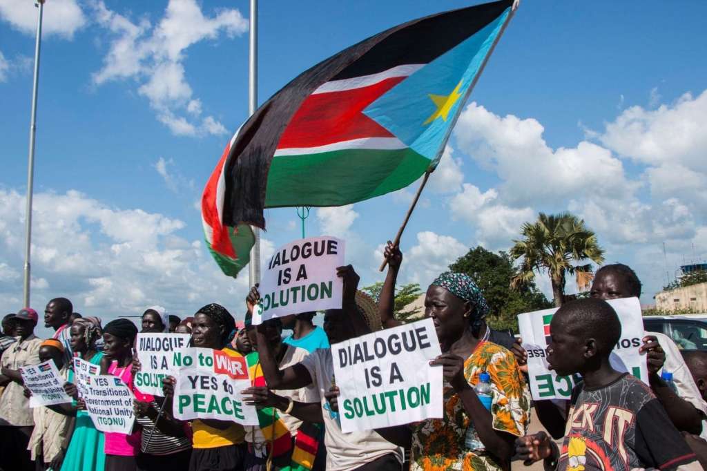 South Sudanese demonstrators await the arrival of President Salva Kiir at Juba International Airport on June 22, 2018. (Akuot Chol/AFP/Getty Images)