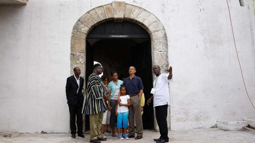 U.S. president Barack Obama, Michelle Obama and their daughters Malia and Sasha stand at the “Door of No Return” during their visit to the Cape Coast Castle, Ghana, July 11, 2009.