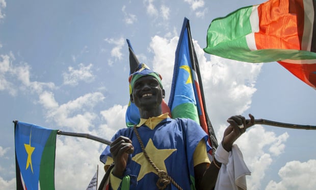 A man waves flags during peace celebrations in Juba, the South Sudanese capital. Photograph: Bullen Chol/AP