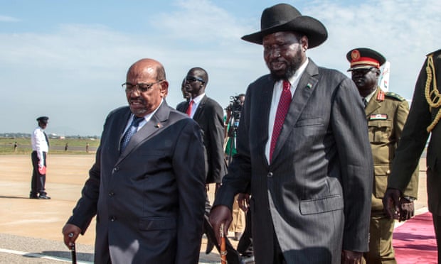  Sudanese president Omar al-Bashir walks alongside South Sudanese counterpart Salva Kiir at Juba international airport. Photograph: Akuot Chol/AFP/Getty Images