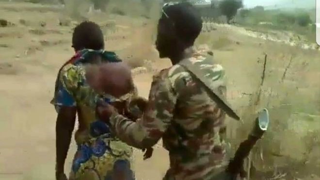 A snapshot of the video where one of the soldiers accompanied a victim to the execution site